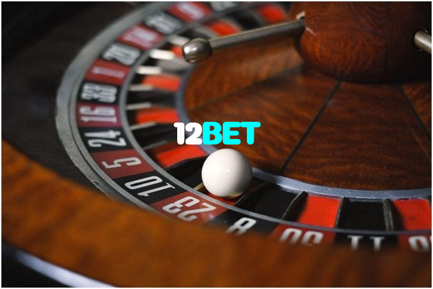 12BET casino presented on mobile device in Pakistan with slots and live games